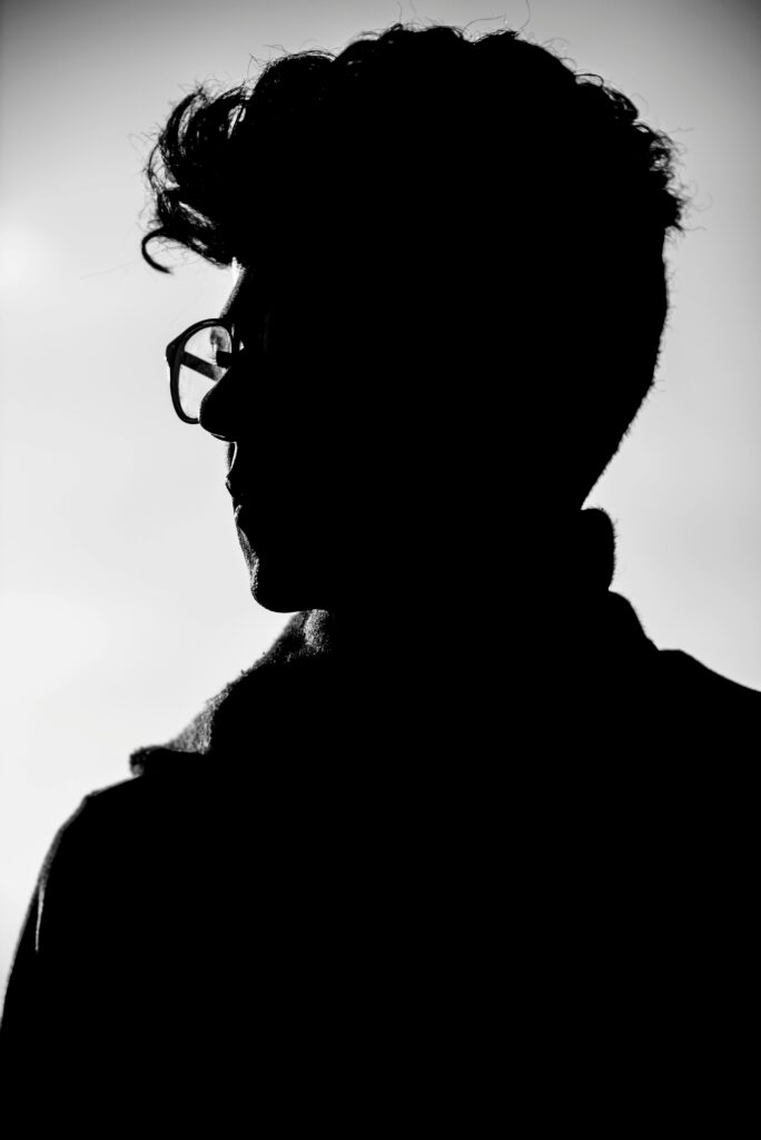 pexels-photo-771742-771742 Artistic black and white profile silhouette of a man wearing eyeglasses.
